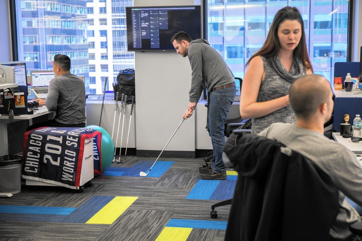 Person playing golf in the office